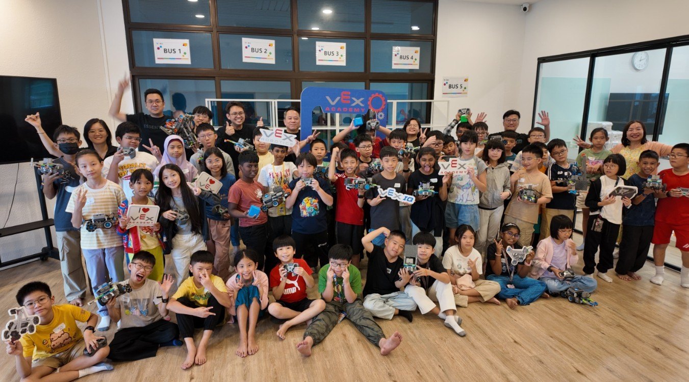 VEX Academy students and trainers with their robots